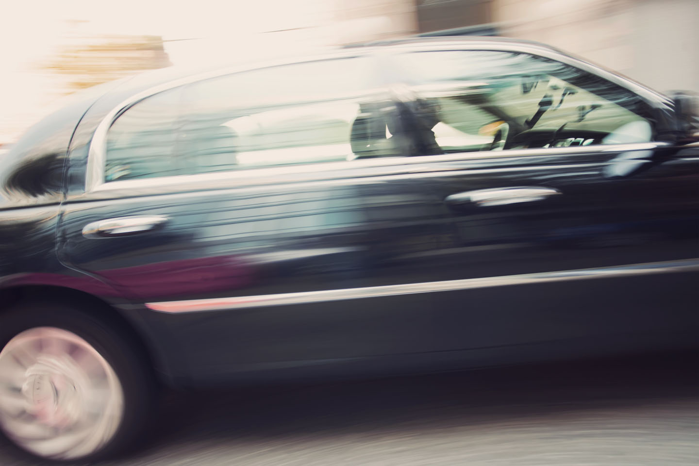 Black Town Car in Motion